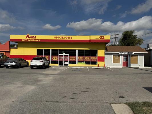 2202-2204 N US Highway 281, Marble Falls, TX 78654 — commercial office building for sale with A-MAX Auto Insurance and Primerica storefronts and highway-frontage parking lot, listed by D. Green & Associates